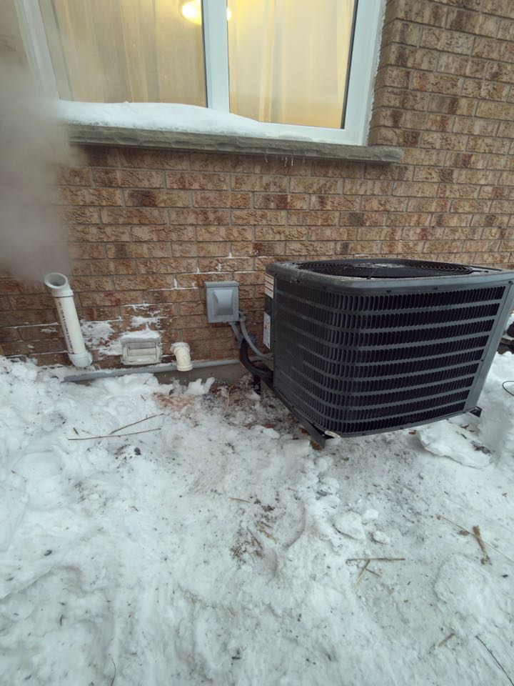 Completing a Furnace and AC installation for a family in New Hamburg