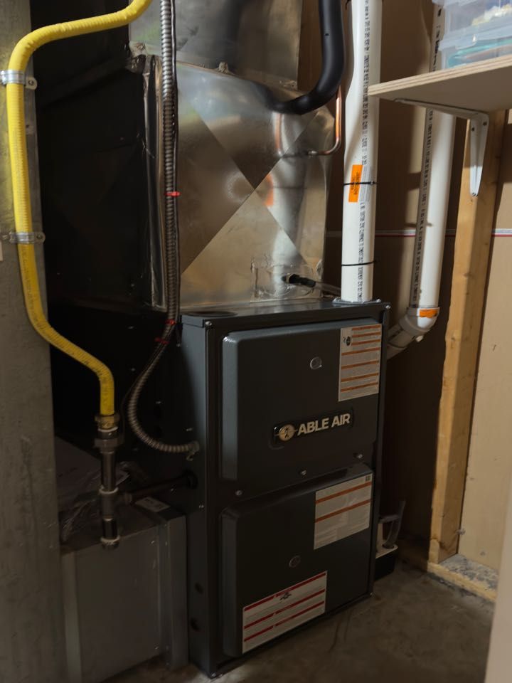 Completing a Furnace and AC installation for a family in New Hamburg