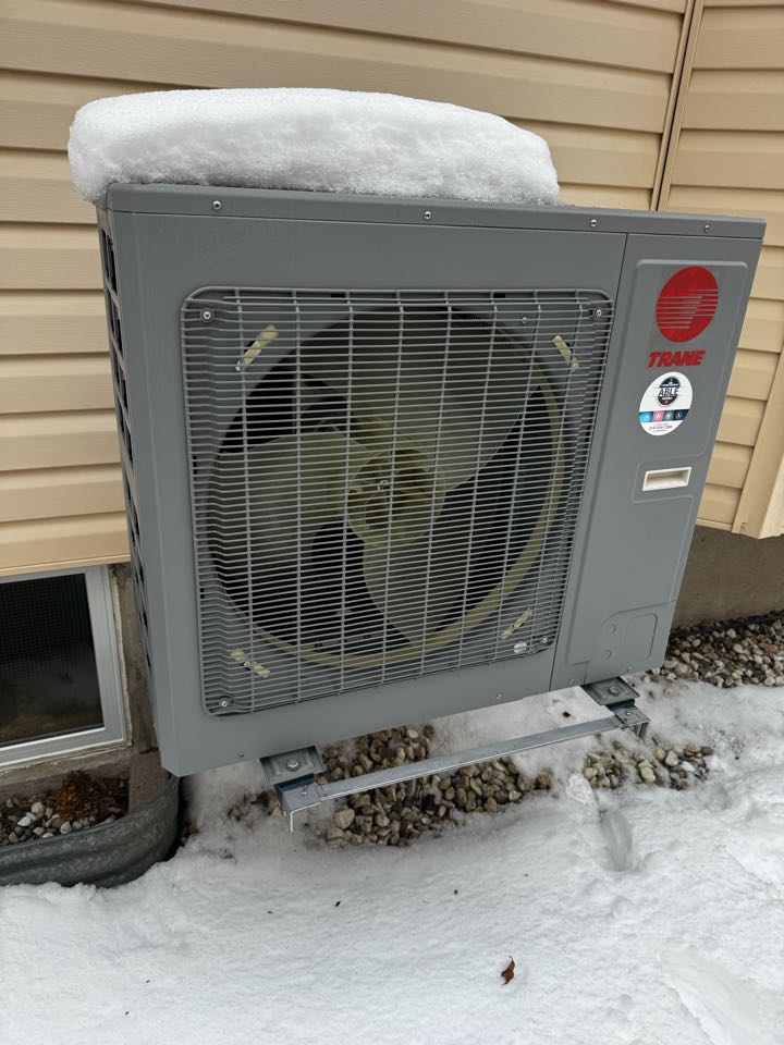 Servicing a Trane heat pump for a family in New Hamburg
