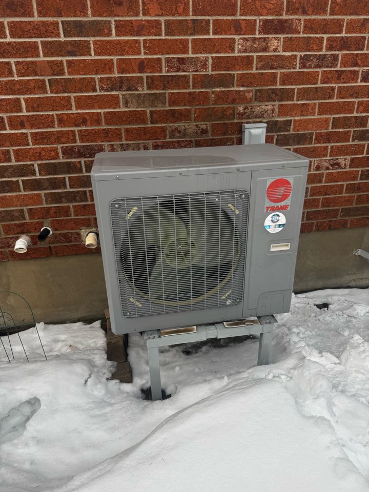 Completing a Trane Heat pump service for a family in Wilmont