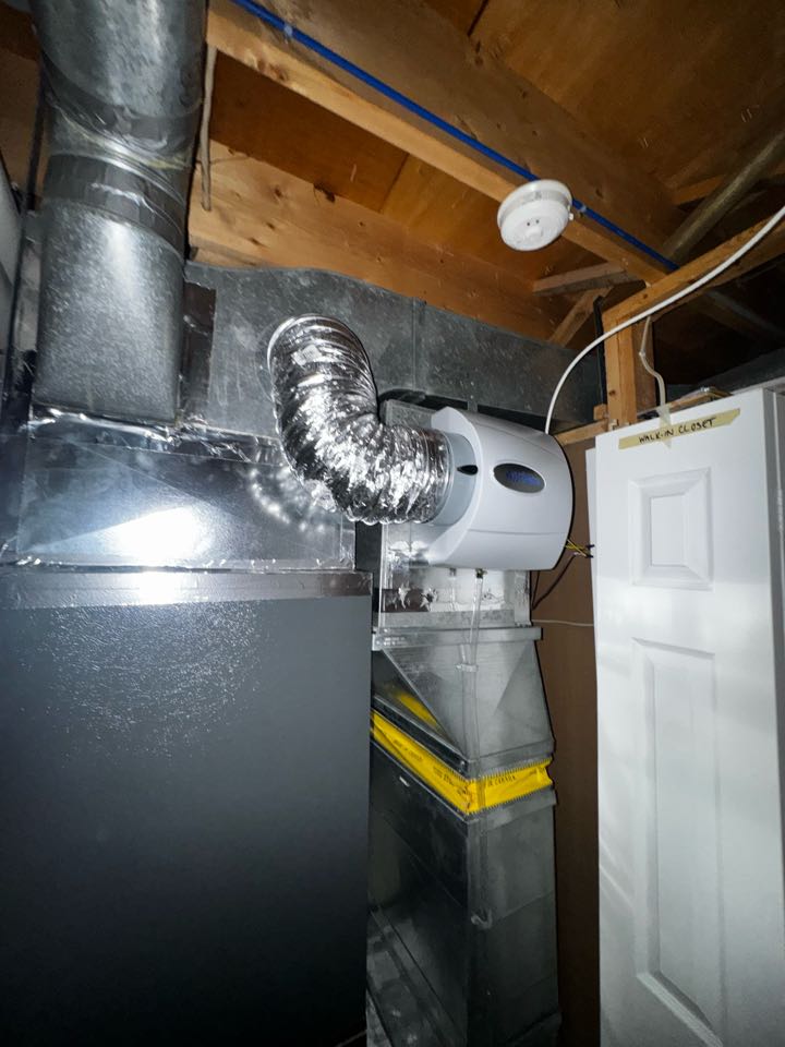 Completing an Aprilaire Humidifier service for a family in the Conestoga mall area of Waterloo 