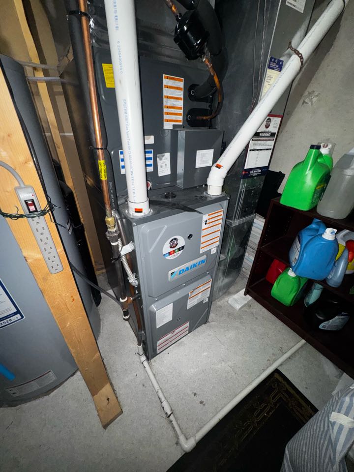 Completing a Daikin furnace service for a family in the Doon Area of Kitchener