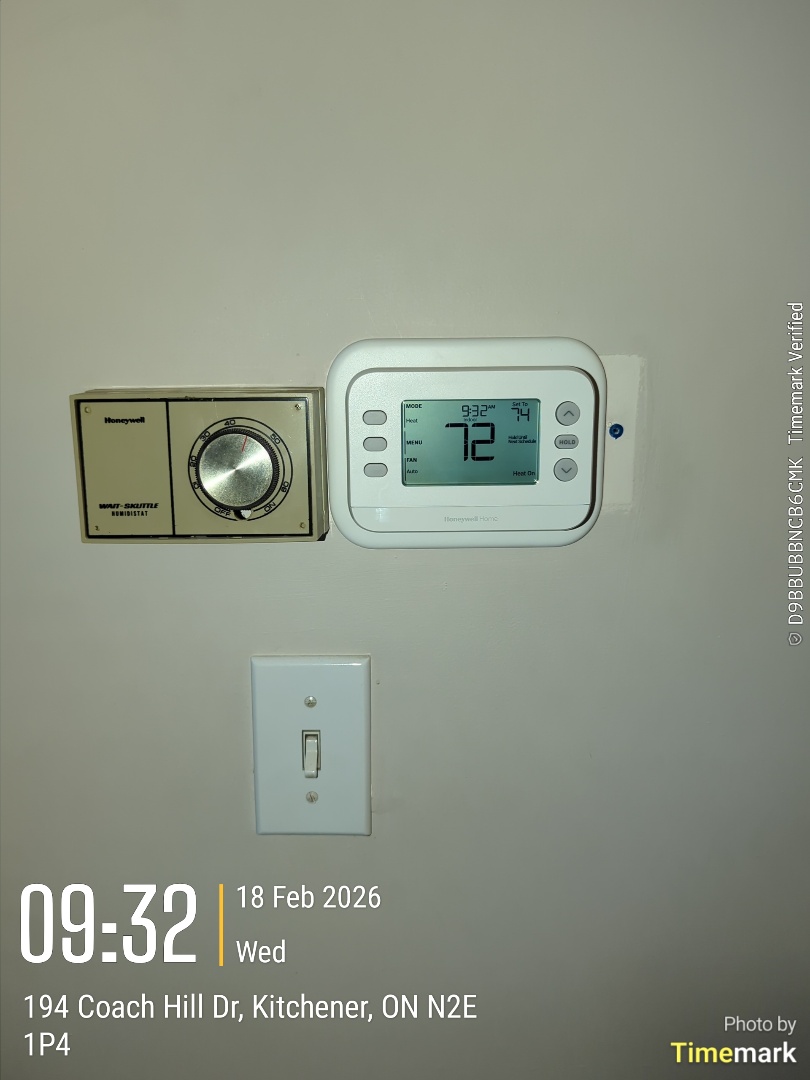 Completing an Amana furnace tune up and installed programmable thermostat for a family in the Country Hills area of Kitchener 