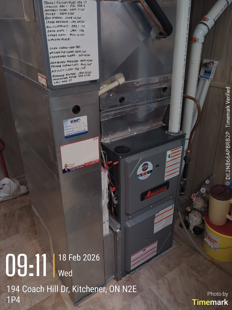 Completing an Amana furnace tune up and installed programmable thermostat for a family in the Country Hills area of Kitchener 
