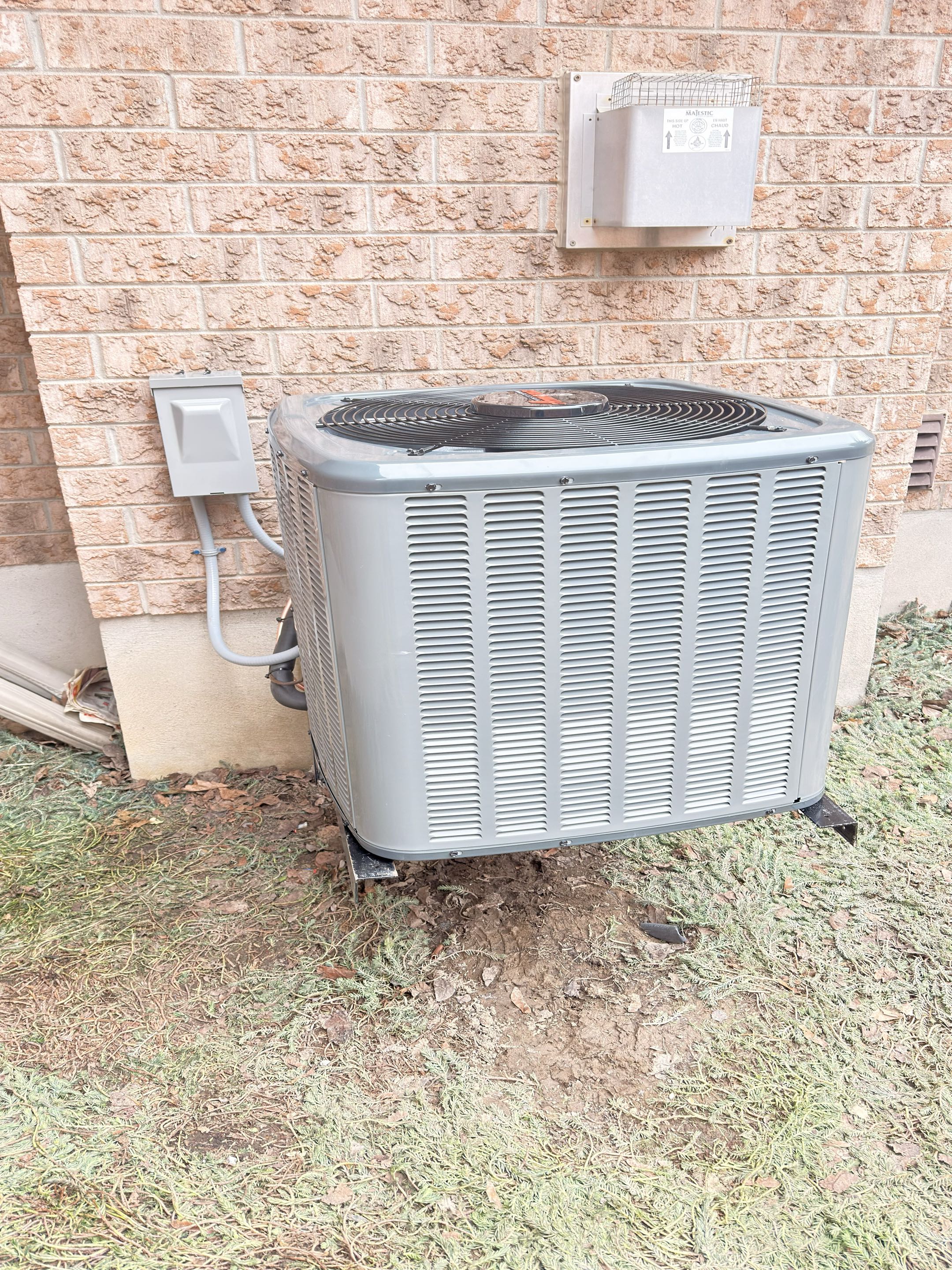 Completing an Amana AC installation for a family in Elora