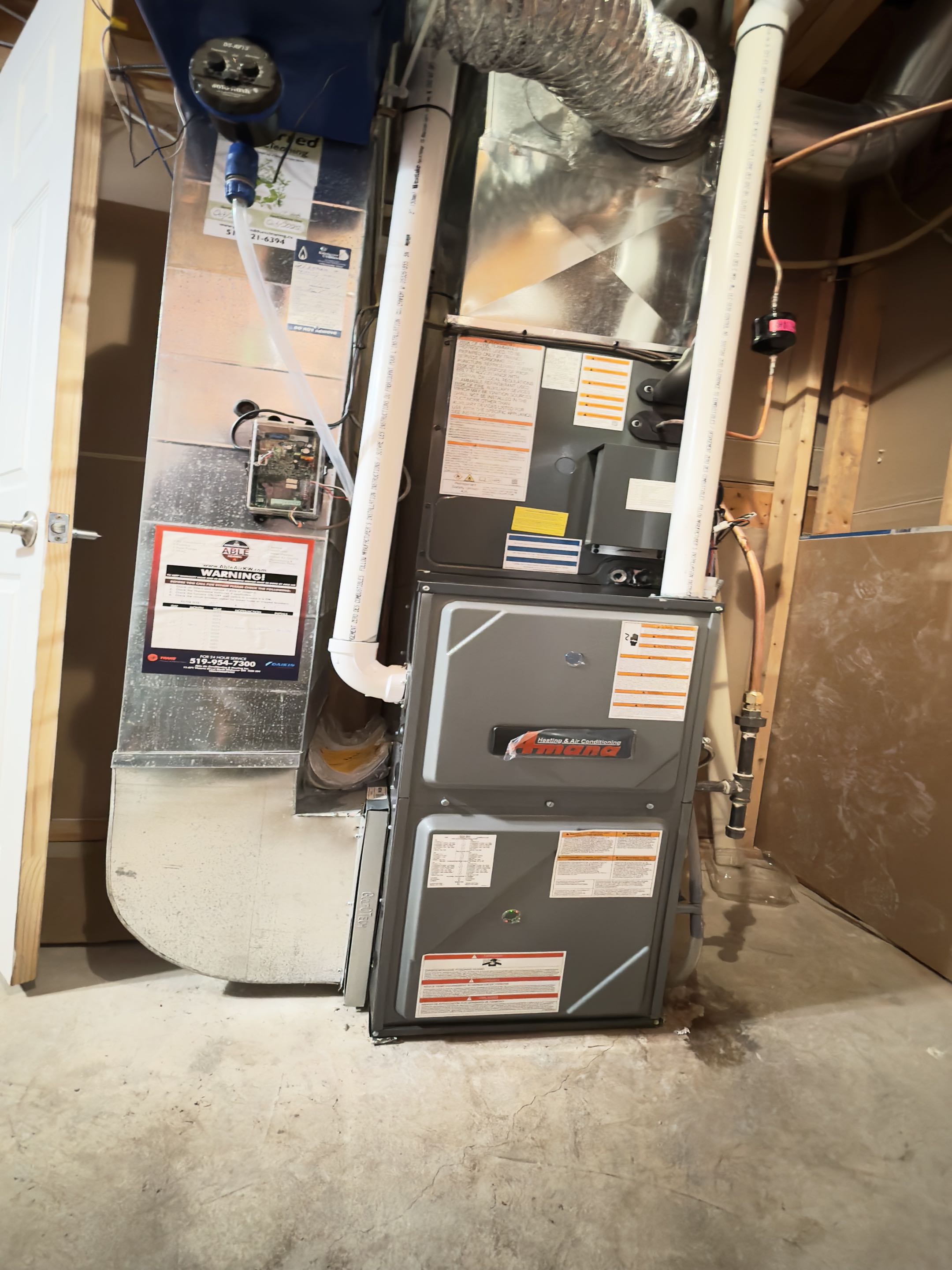 Completing an Amana Heat Pump and furnace Installation for a family in the Williamsburg area of Kitchener