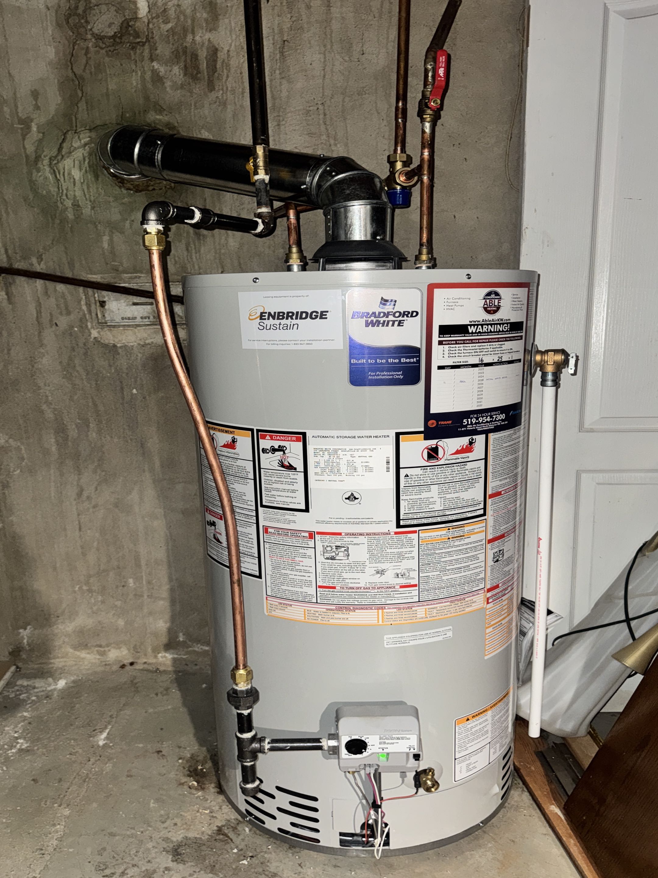 Completing a Bradford White Water heater installation for a family in the Alison area of Cambridge