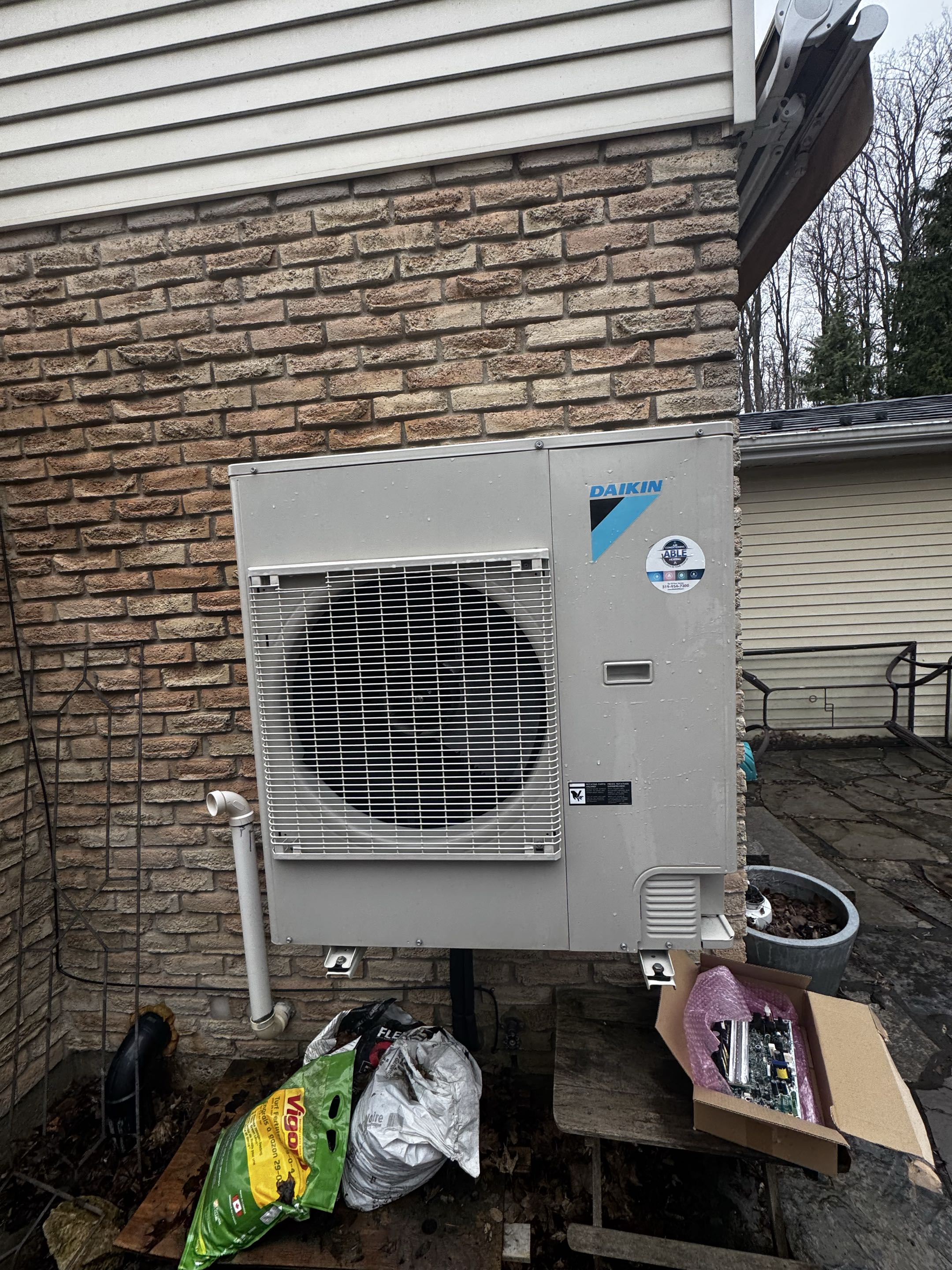Completing a Daikin heat pump service for a family in the Forest Heights area of Kitchener 
