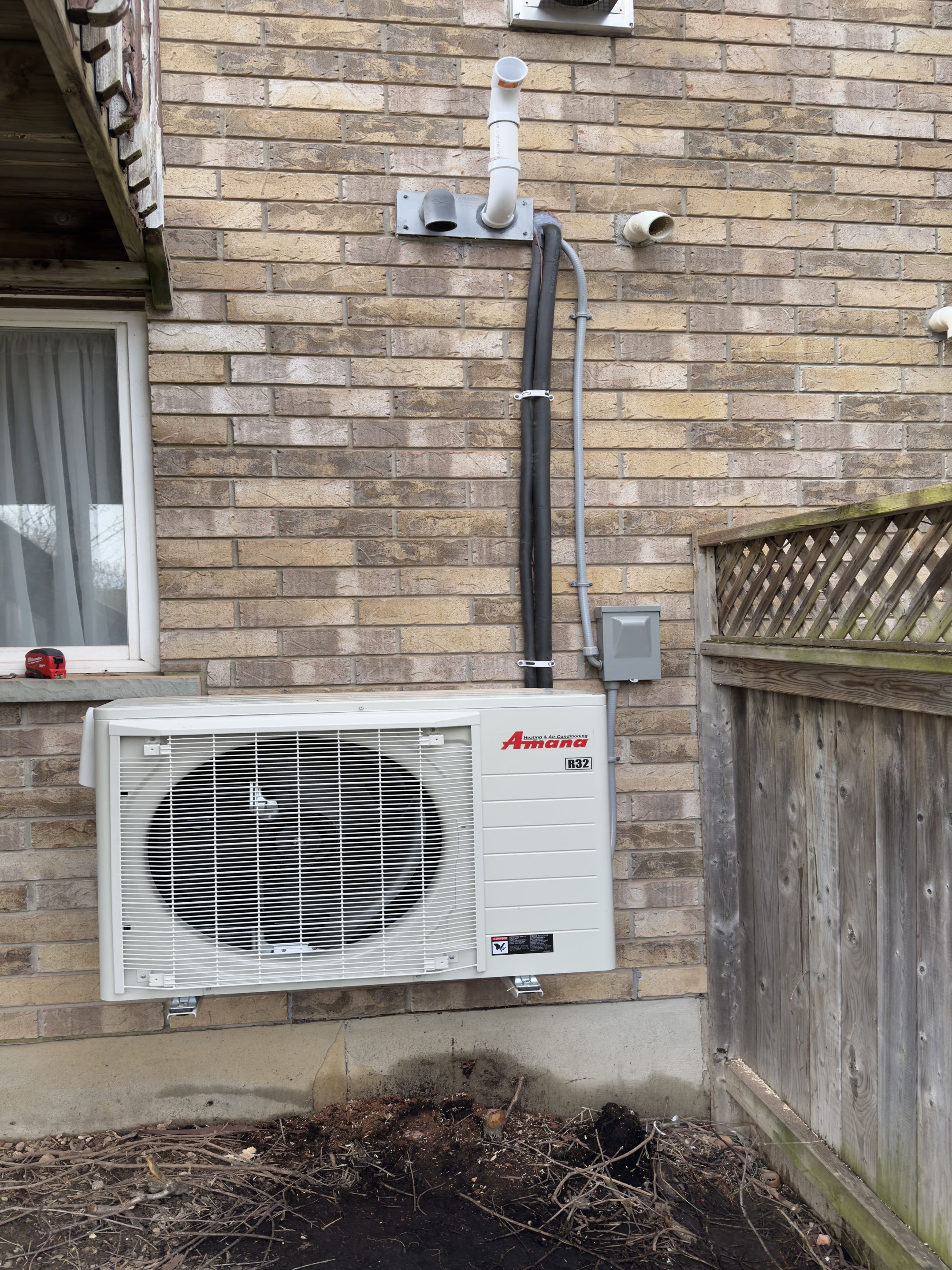 Completing an Amana Heat pump installation for a family in the Grange Hill East area of Guelph