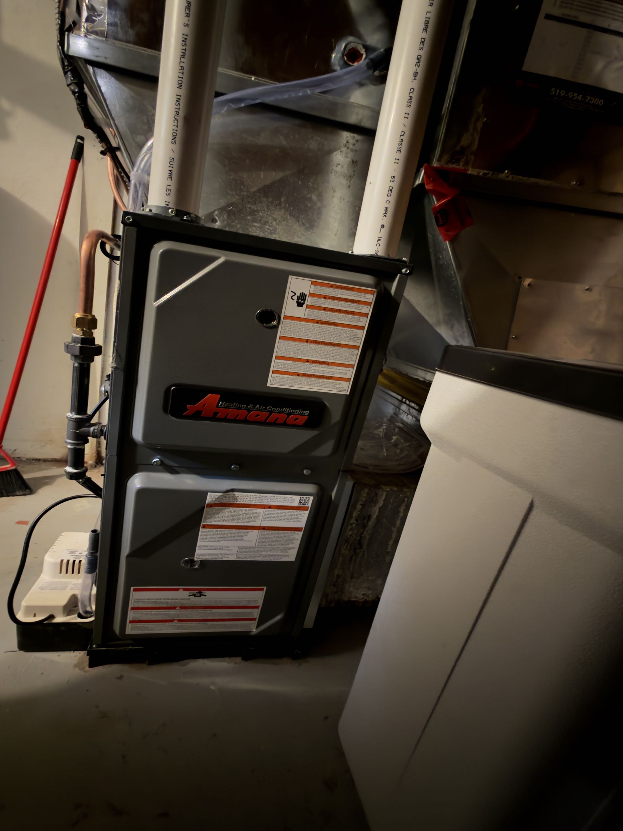 Completing an Amana furnace and AC installation for a family in the Lakeshore Village area of Waterloo