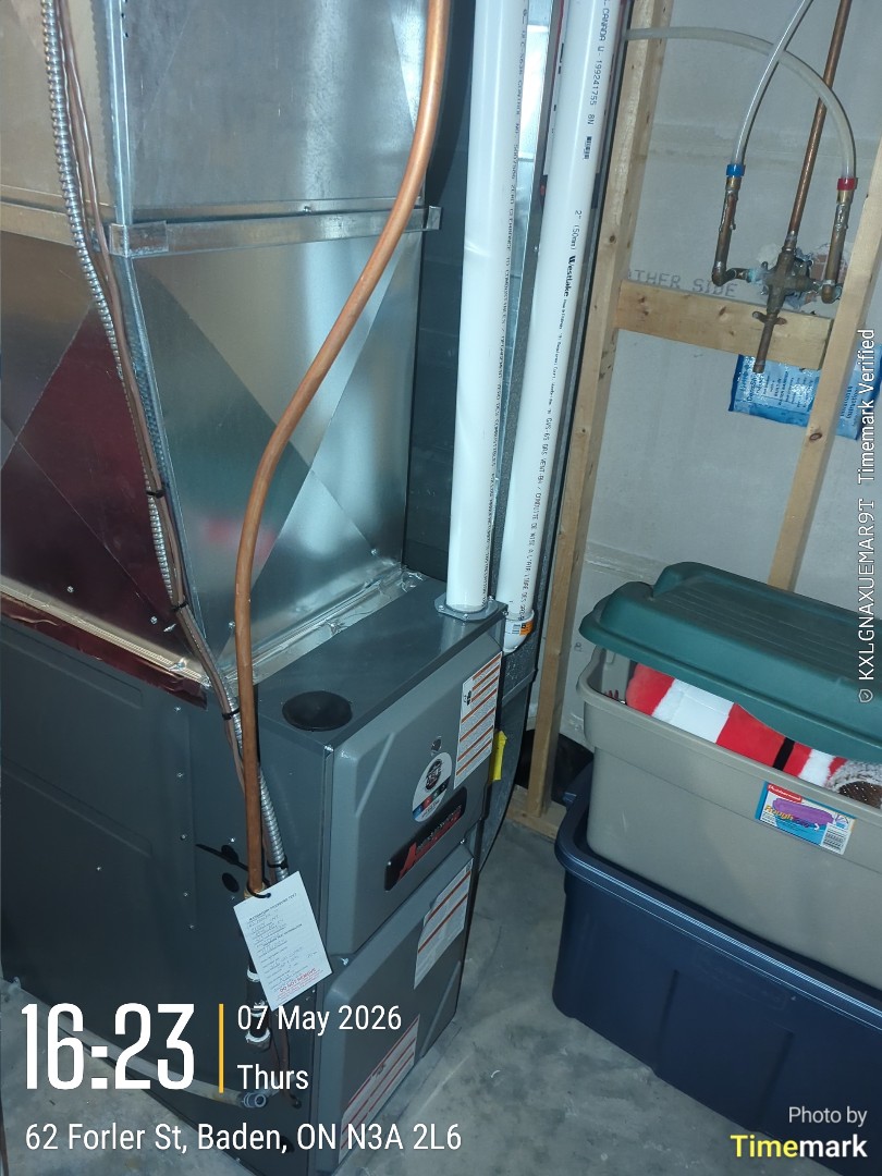 Completing an Amana furnace and AC tune-up for a family in Baden