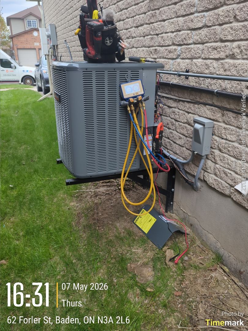 Completing an Amana furnace and AC tune-up for a family in Baden