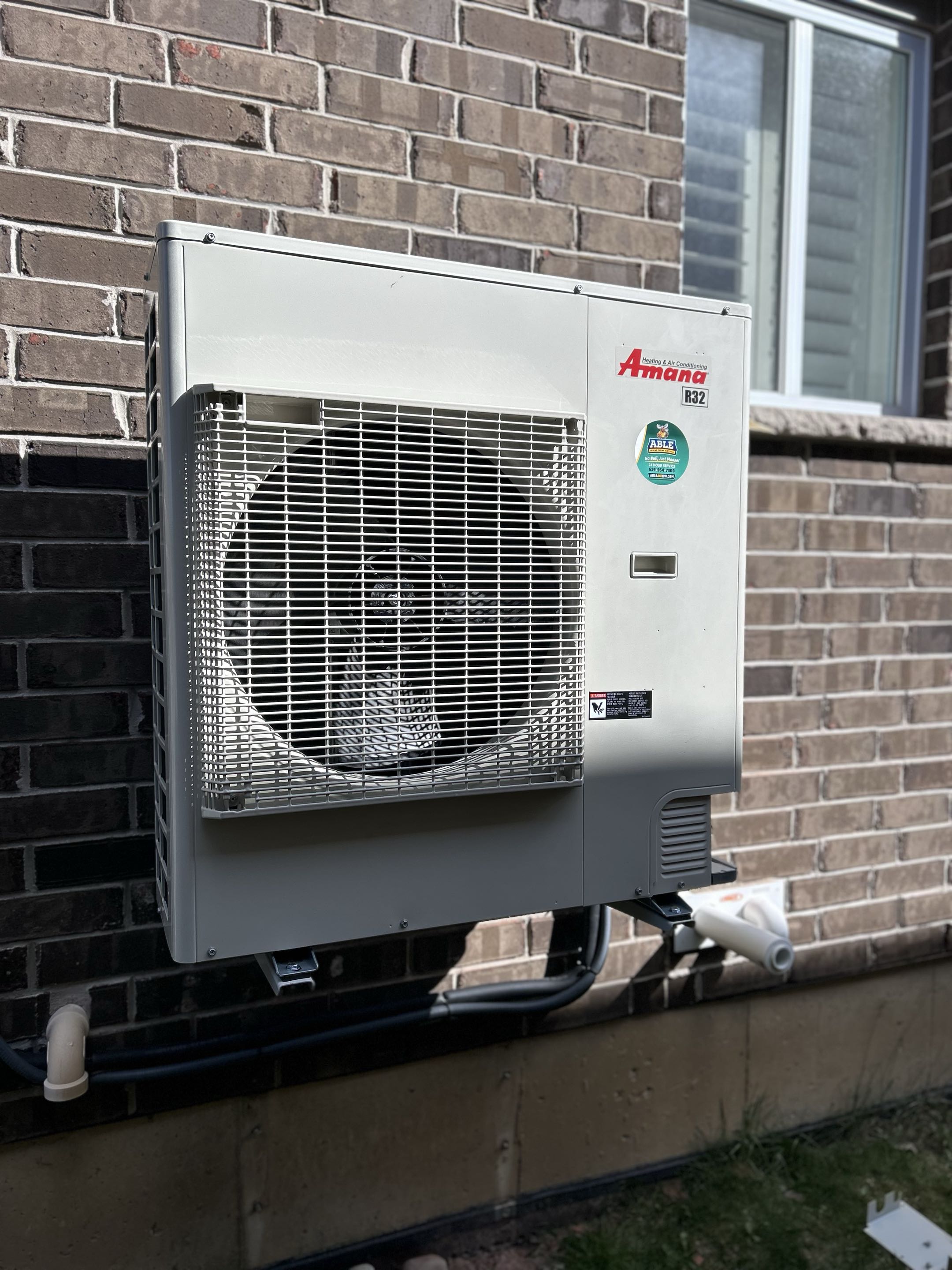 Completing an Amana heat pump install for a family in Baden