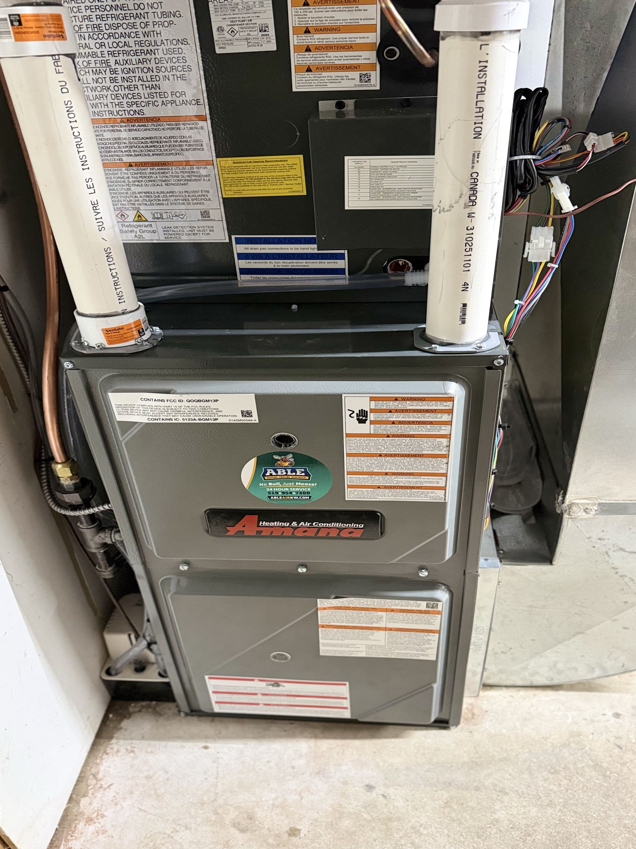 Completing an Amana furnace and heat pump for a family in New Hamburg 