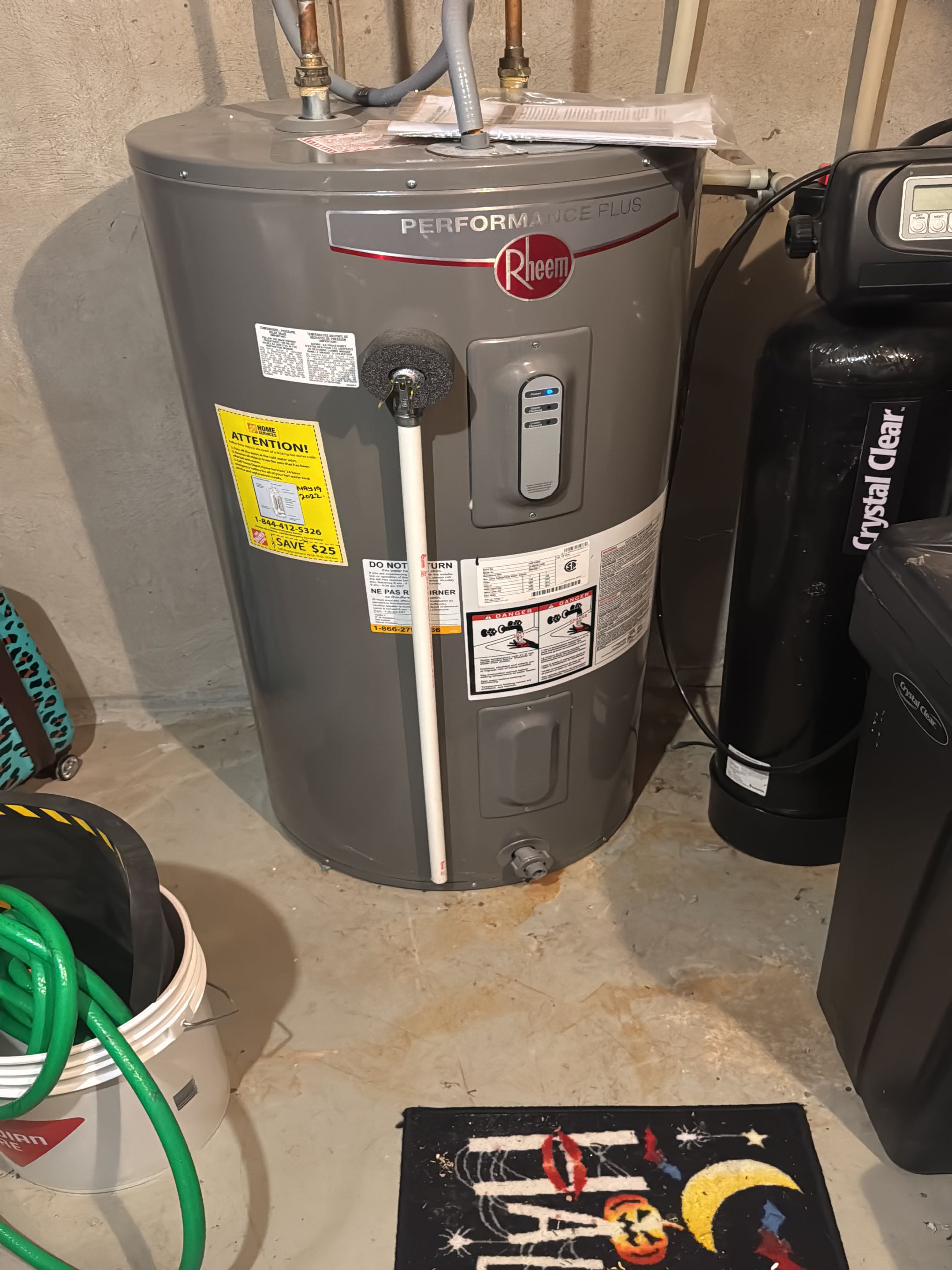 Completing an Rheem Water heater service for a family in Waterloo