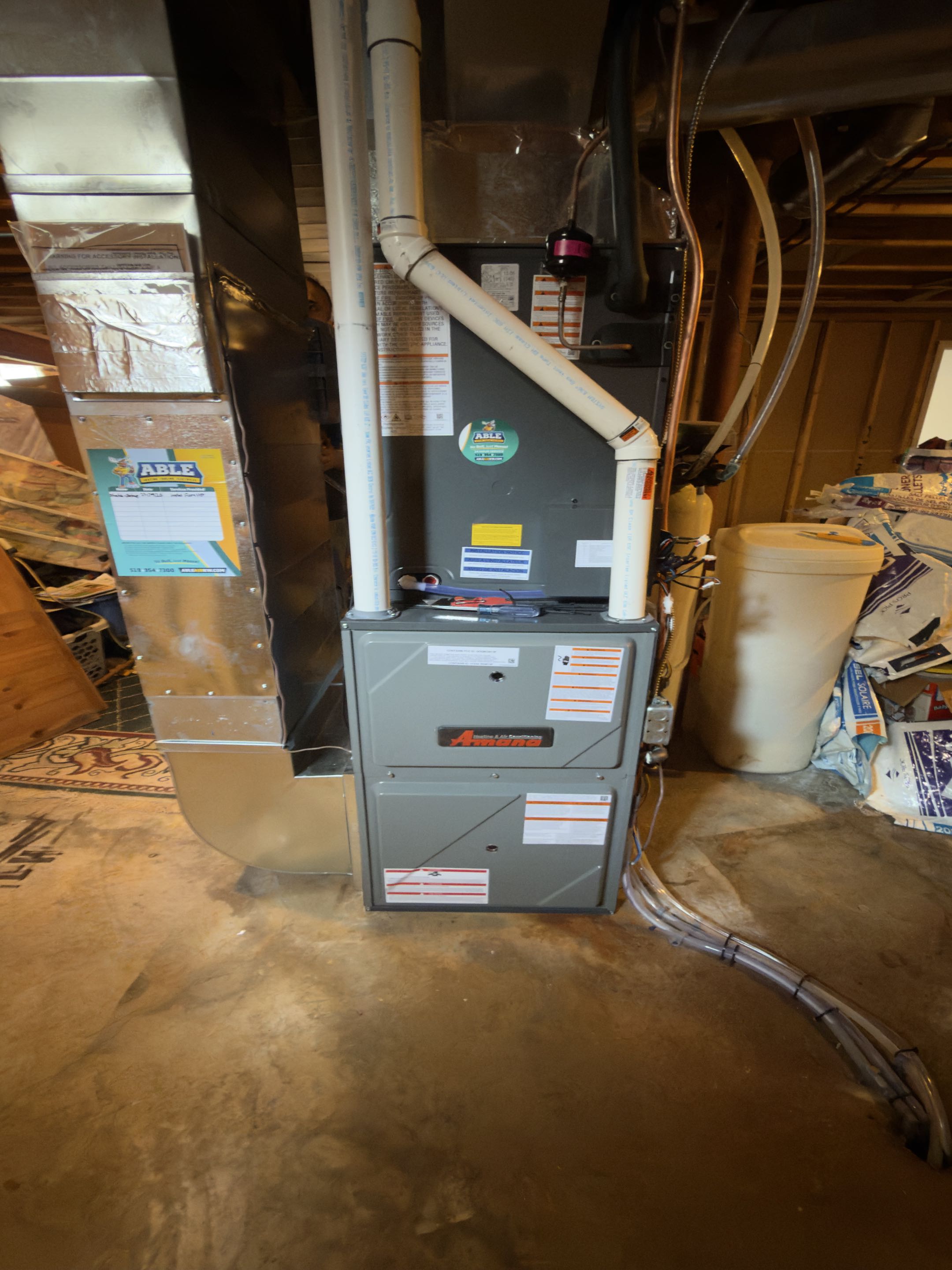 Completing an Amana Heat pump and furnace installation for a customer in Cambridge