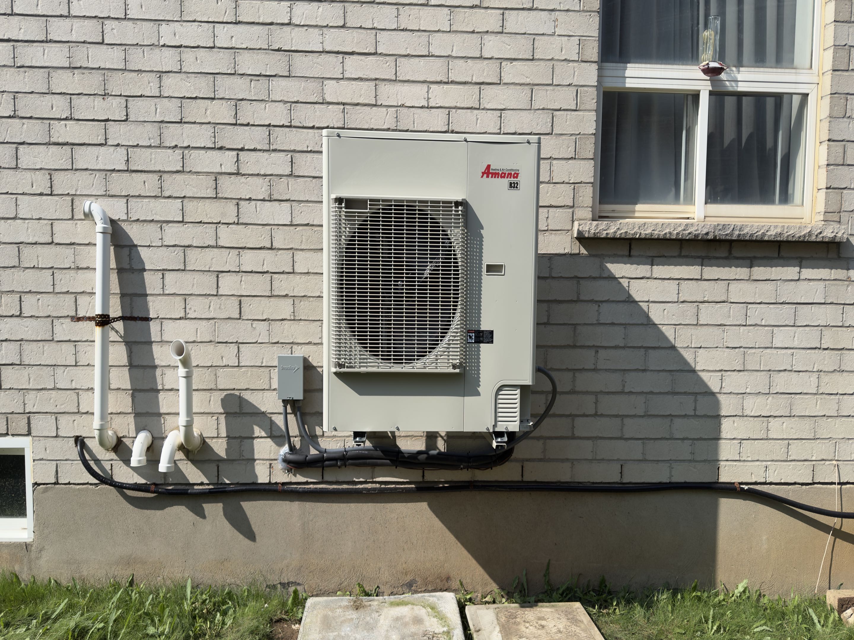 Completing an Amana Heat pump and furnace installation for a customer in Cambridge