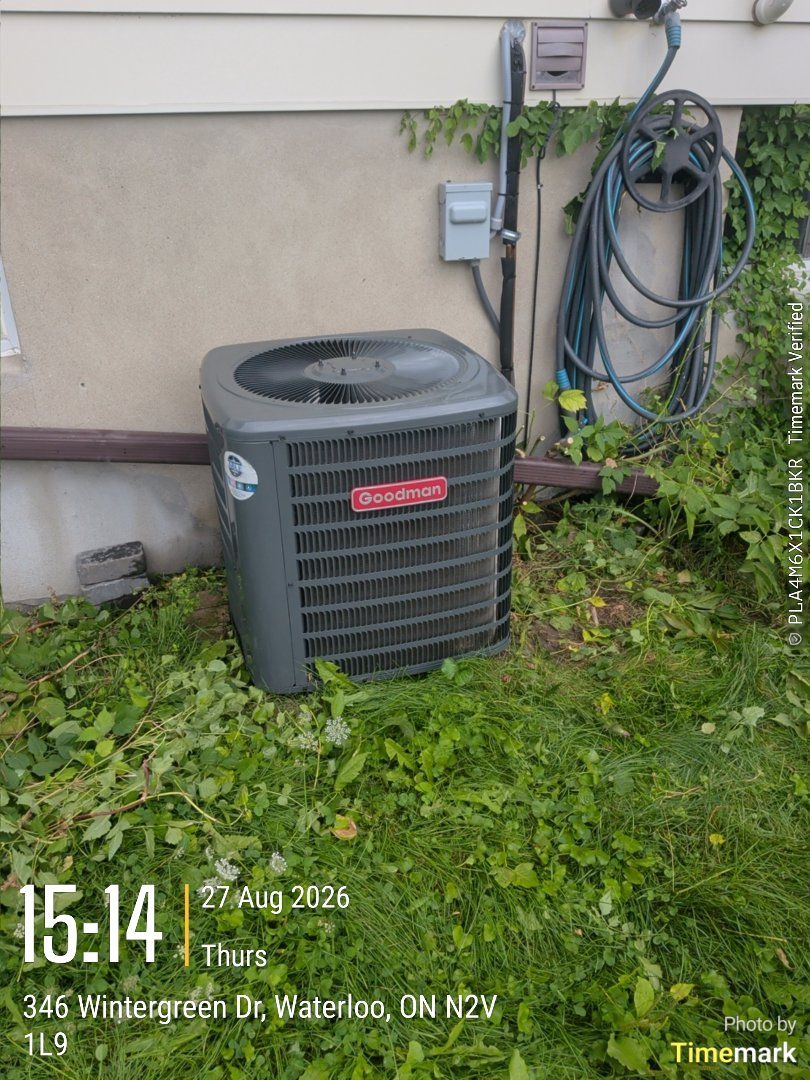 Completing a Goodman AC tune-up for a family in Waterloo