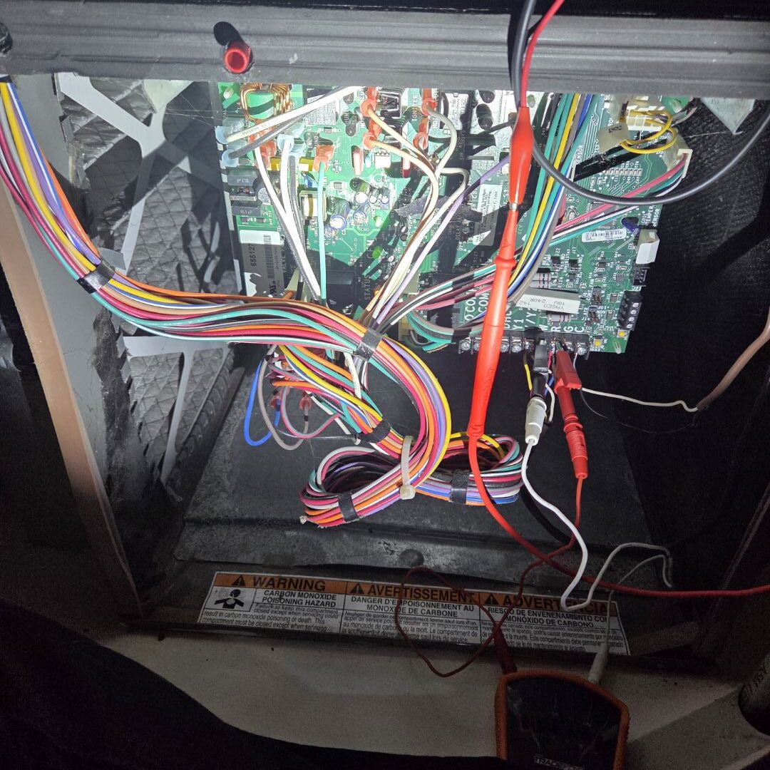 Completing an AC and Furnace Maintenance for a family in Kitchener