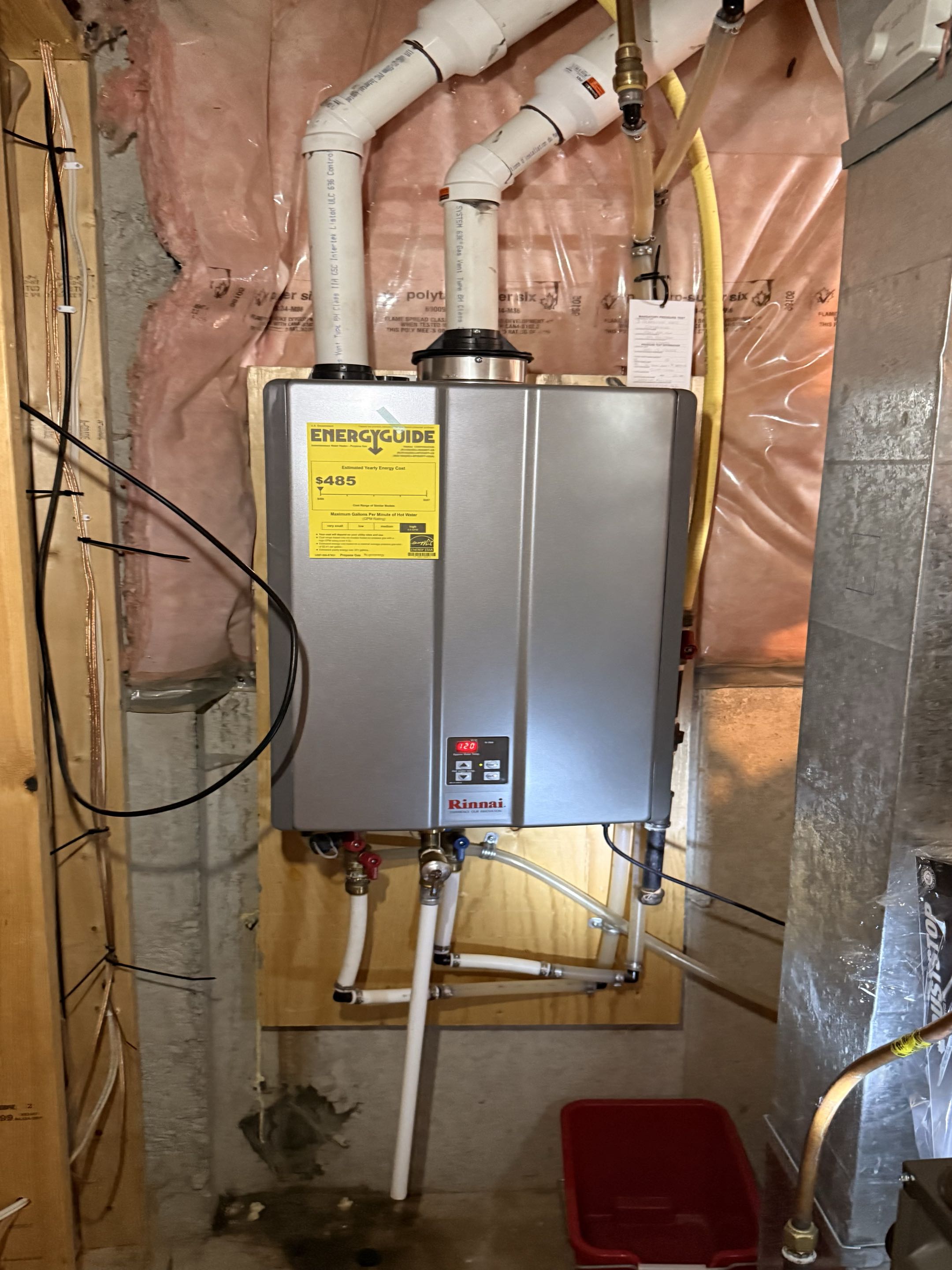 Serviced a Rinnai tankless water heater and repaired a leaking drain fitting. Repeated testing confirmed no further leakage at the repaired connection.