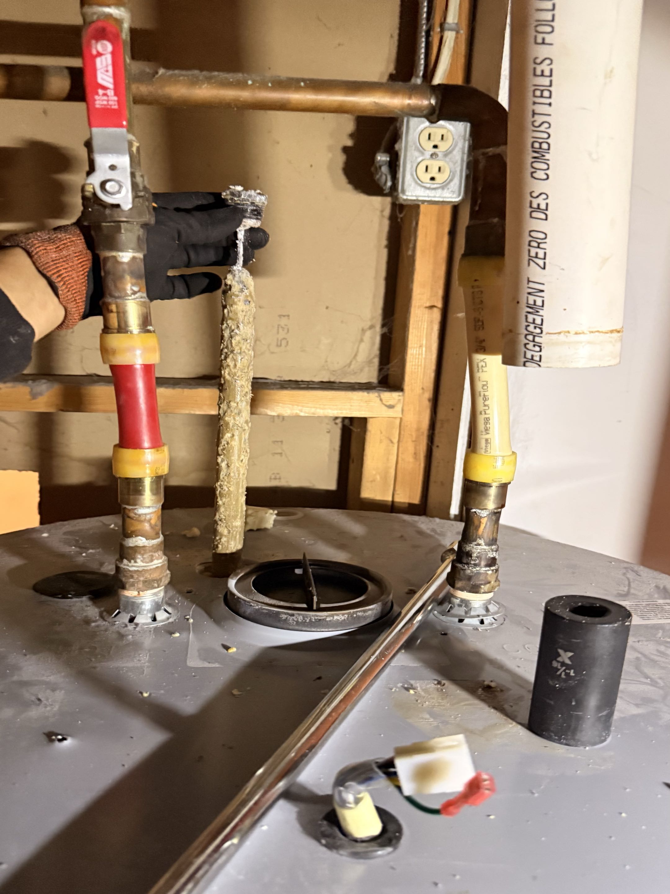 Completed an anode rod replacement and thorough flush on a John Wood water heater. Replaced the heavily deteriorated rod and flushed the tank three times until the water ran clear. Refilled and restarted the unit, confirming normal operation.