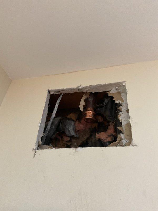 Responded to emergency call for burst pipe. Located and repaired hot water valve that had detached from water line, requiring wall access for repair. Restored proper water flow and verified system integrity after completion.