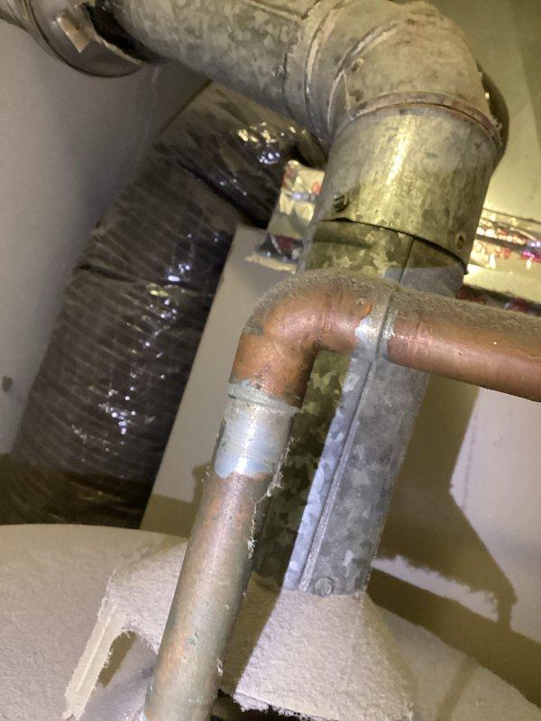 Conducted water heater estimate for client reporting pilot light failure and leaking issues. Inspected existing plumbing configuration, including copper piping, P-trap assembly, and ventilation ductwork. Client has home warranty coverage through Consumers Plan, which was previously unable to resolve the reported issues.