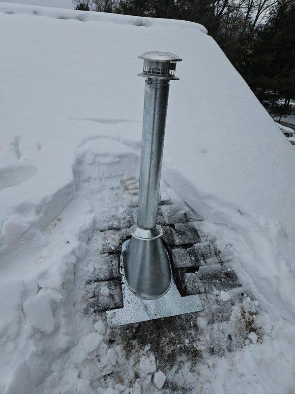 Completed installation of new unit heater with proper electrical connections verified at the breaker panel. Ensured proper venting through existing roof penetration, with snow cleared from vent area to maintain proper airflow. All work photographed for virtual inspection documentation.