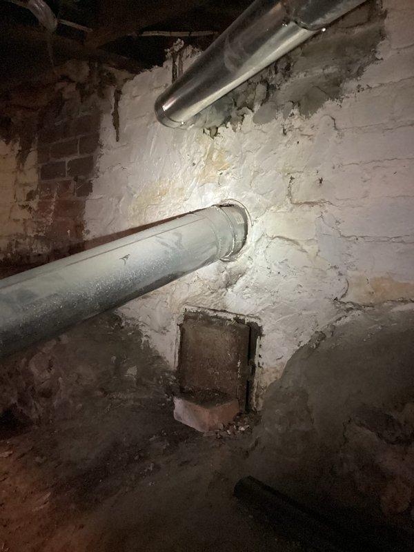 Responded to no-heat call where furnace was blowing cold air. Upon inspection, discovered severe corrosion and deterioration of gas supply pipe with significant blue-green oxidation indicating gas leak potential. Replaced damaged section of gas piping and restored proper gas flow to unit, allowing system to ignite and produce heat correctly.