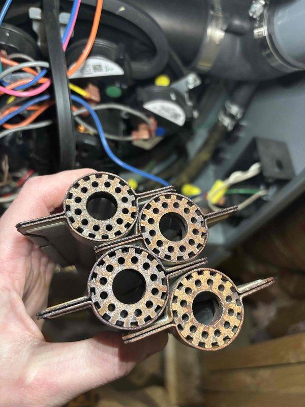 Performed annual maintenance on 12-year-old ENE furnace and humidifier. Removed and inspected four circular mounting brackets showing normal wear. All components were properly reinstalled and system operation verified to manufacturer specifications.