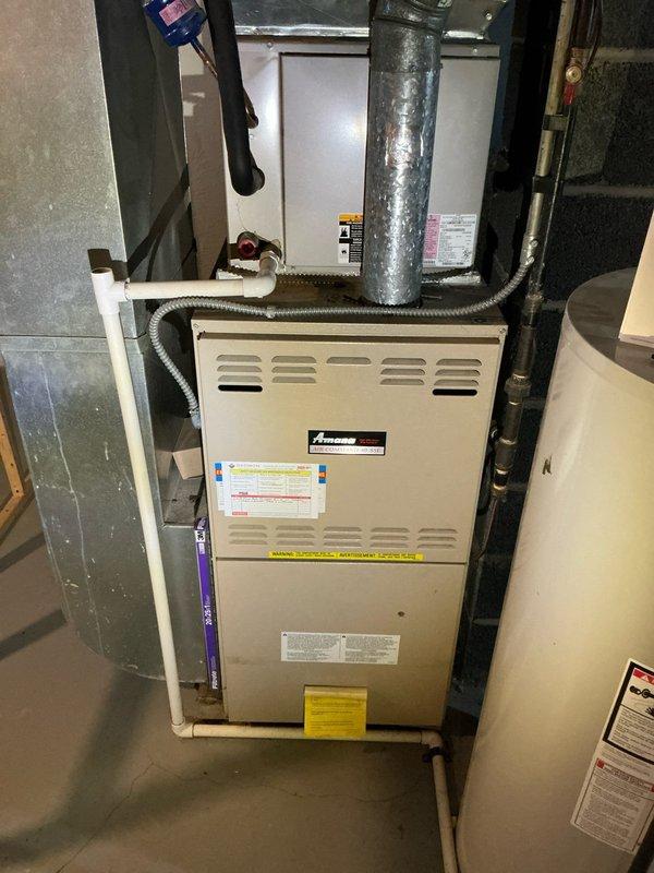 Responded to customer complaint of furnace short cycling where blower activates but system shuts off after heat exchanger fires. Diagnosed 15-year-old Amana furnace system with inspection of heat exchanger, flame sensor, and control board. Recommended replacement options due to age of unit and potential safety concerns with failing components.