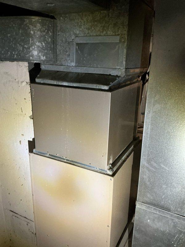 Responded to customer complaint of furnace short cycling where blower activates but system shuts off after heat exchanger fires. Diagnosed 15-year-old Amana furnace system with inspection of heat exchanger, flame sensor, and control board. Recommended replacement options due to age of unit and potential safety concerns with failing components.