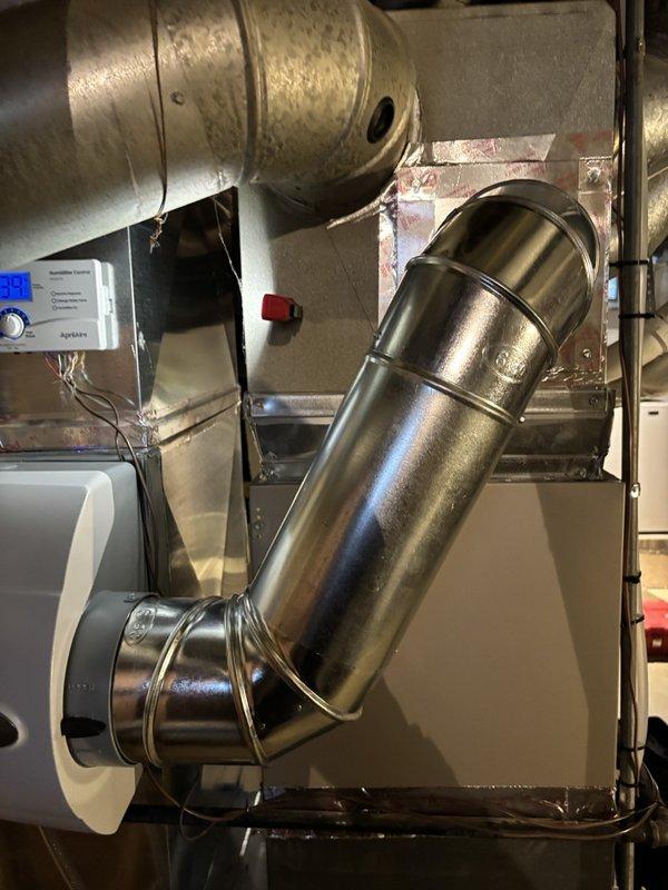 Installed whole-home humidifier system with automatic humidity control. Set up copper water supply line with shutoff valve in utility area. Connected unit to existing HVAC ductwork and verified system operation with digital control panel displaying humidity reading of 38%. Technician Gavin scheduled to return for automatic humidity control installation.