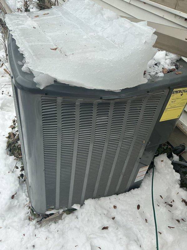 Responded to emergency service call for ice damage to outdoor AC unit. Upon inspection, discovered substantial ice accumulation on condenser top surface resulting from apparent ice fall from above structure. Documented pre-existing damage with photos for insurance claim purposes. Unit requires replacement of damaged condenser coil and protective grille assembly. Provided documentation for warranty claim under ENE WT 4-2034.