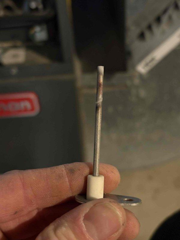 Performed comprehensive furnace tune-up on aging unit. Inspected and replaced deteriorated igniter assembly showing signs of corrosion. Also removed and replaced damaged flame sensor components which exhibited wear on contact points. System now operating at proper efficiency.