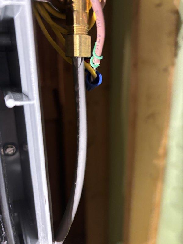 Responded to service call for Energi WT humidifier (7 years old) that was dripping water. Inspected connections and control wiring at the solenoid valve. Removed and cleaned the humidifier's metallic mesh filter which had accumulated mineral deposits causing overflow. Reinstalled and tested system, confirming proper operation with no further leakage.