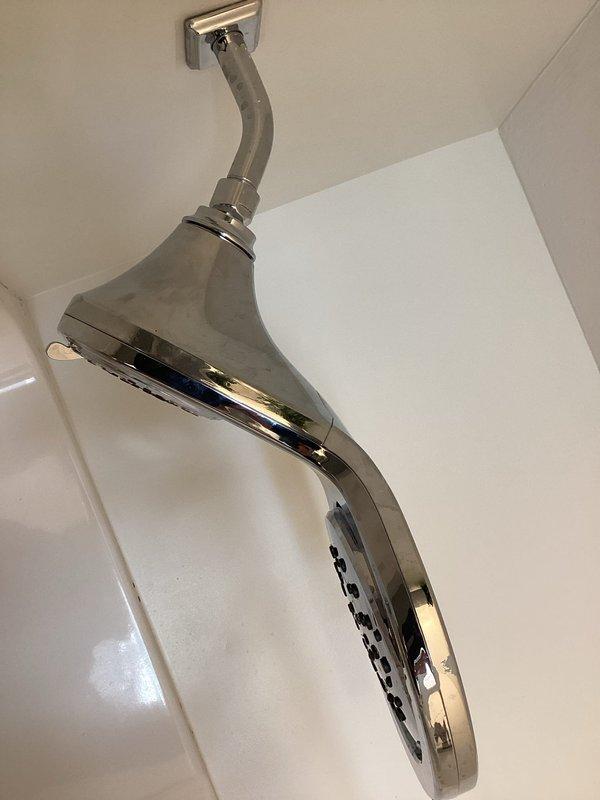 Addressed low water pressure issue in bathroom by replacing worn O-ring gasket using specialized pick tool. Successfully installed new chrome shower head with improved spray pattern to restore proper water flow functionality.