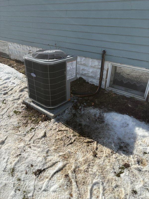 Successfully completed installation of new Carrier furnace system and outdoor AC unit. All equipment properly mounted with appropriate connections to existing ductwork and properly vented with PVC pipes. System installed on concrete pad with copper refrigerant lines properly connected to home.