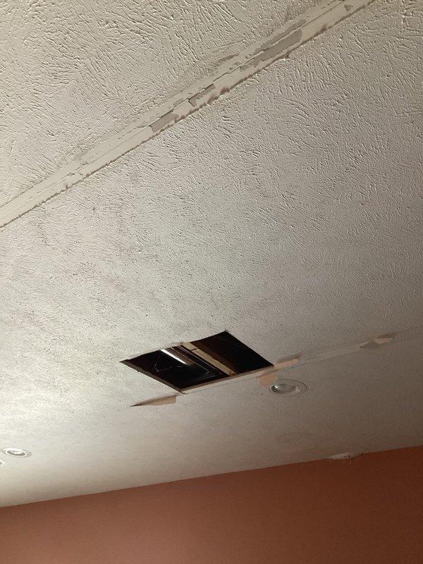 Conducted site assessment for new island prep sink installation, focusing on plumbing requirements. Inspected ceiling access points to evaluate existing water supply lines and drainage infrastructure. Documented current conditions including visible piping configuration and structural elements to determine optimal connection points for the proposed fixture.