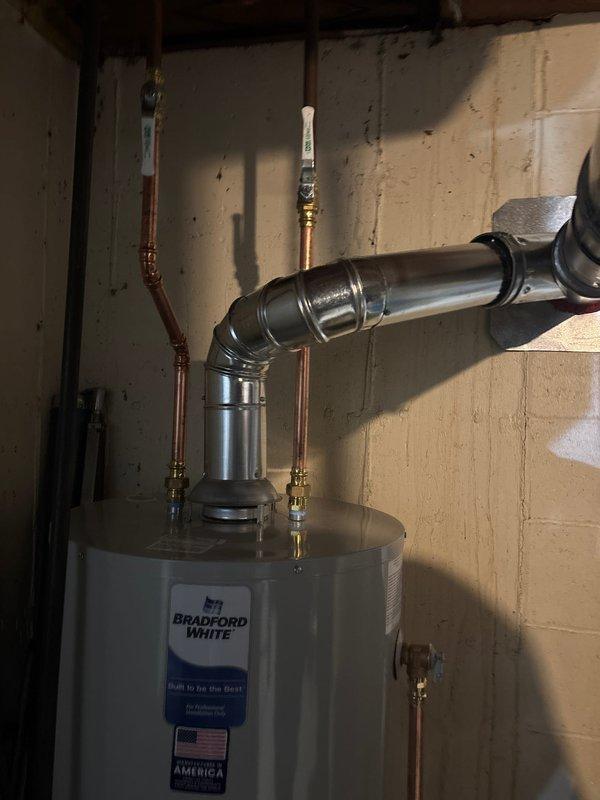 Successfully installed a new furnace and Bradford White water heater in customer's utility room. Completed all necessary connections to existing ductwork and plumbing systems, including proper venting with 90-degree elbow pipes. Both units were tested for proper operation and all installations meet current code requirements.