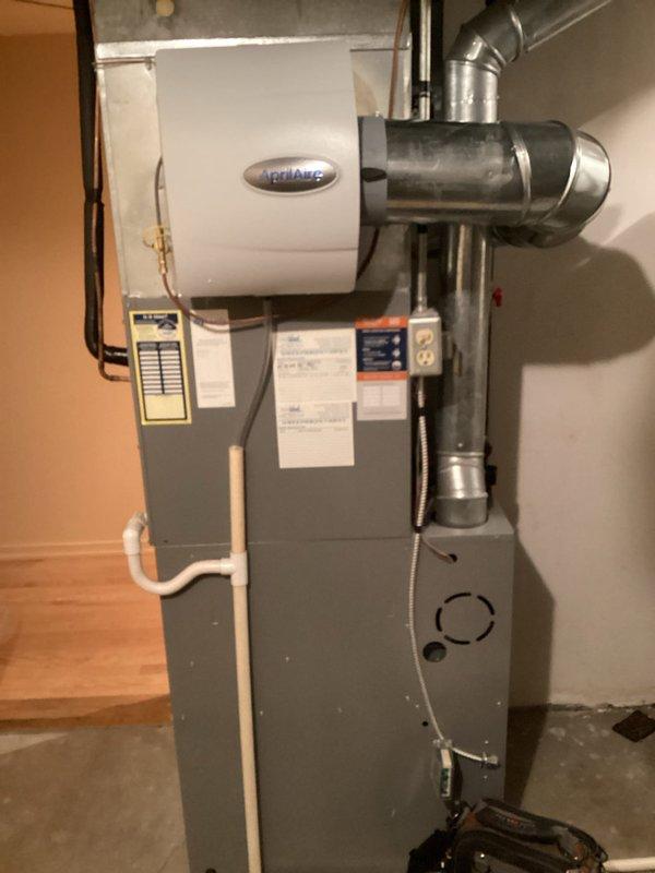 Successfully installed an Aprilaire humidifier with manual control on the first floor HVAC system. Connected copper water lines with isolation valves for proper water supply to the unit. Mounted the humidifier to the furnace plenum and verified proper drainage and electrical connections to ensure optimal humidity control.