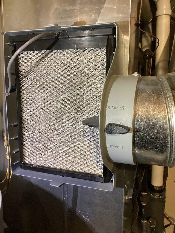 Completed annual heating service on EnergiAir system (model WT 08-2031, CM 2022). Performed furnace tune-up and inspected humidifier components. Replaced soiled humidifier filter panel with new mesh element and verified proper operation of the summer/winter bypass system. System now functioning within normal parameters.