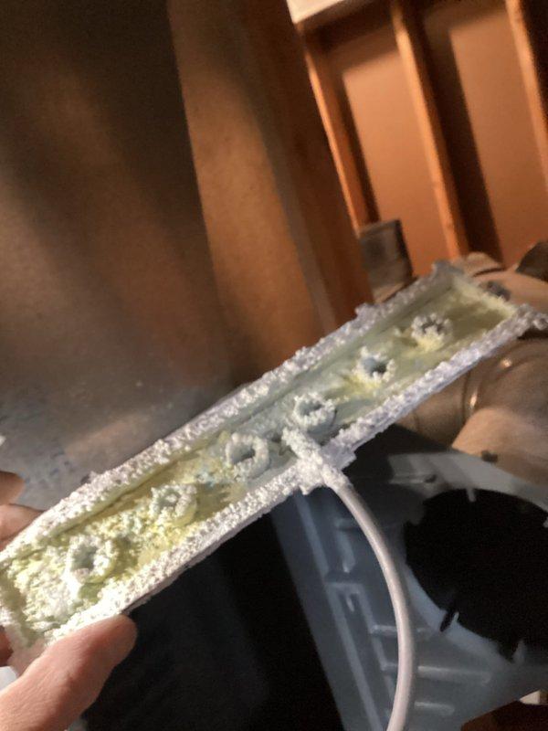 Responded to water leak service call for 9-year-old Carrier unit with warranty through 11-2026. Diagnosed severe frost buildup on evaporator coil causing water leakage while furnace continued heating operation. Identified significant mineral scale accumulation on components. Defrosted system and performed necessary cleaning to restore proper operation.