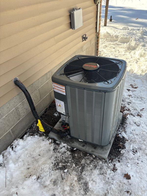 Successfully completed full system installation, replacing existing equipment with new Trane outdoor AC unit and furnace. Installed unit on concrete pad with proper electrical disconnect and refrigerant line connections. System includes appropriate condensate drainage with PVC piping. Water heater replacement was also completed as part of the comprehensive HVAC upgrade.