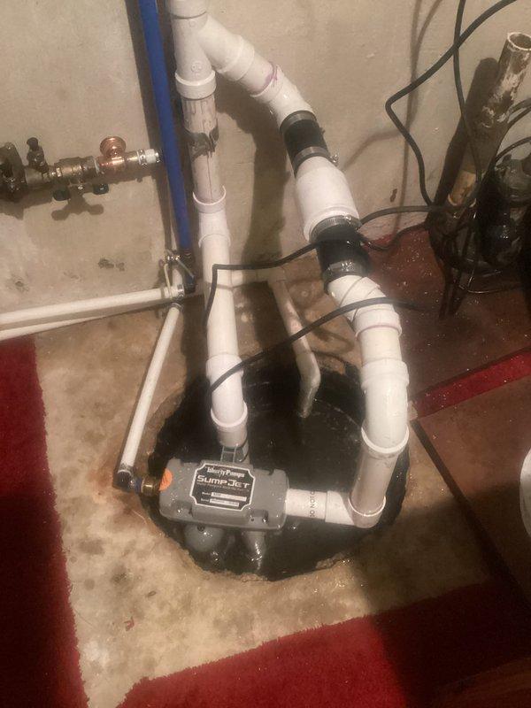 Diagnosed and repaired faulty sump pump system that was intermittently backing up due to a broken discharge pipe clamp. Replaced damaged connection, sealed all joints with appropriate plumbing cement, and secured proper fasteners to eliminate water spray during activation. Tested system through multiple cycles to confirm proper operation and drainage.