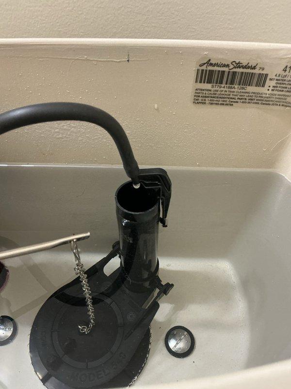 Responded to warranty service call for one of two American Standard toilets installed in December that was not functioning properly. Diagnosed issue with the float mechanism causing improper filling operation. Adjusted float assembly and tested water level cycling to verify proper operation; toilet now fills and flushes correctly.