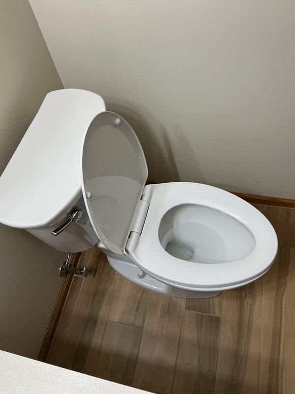 Responded to warranty service call for one of two American Standard toilets installed in December that was not functioning properly. Diagnosed issue with the float mechanism causing improper filling operation. Adjusted float assembly and tested water level cycling to verify proper operation; toilet now fills and flushes correctly.