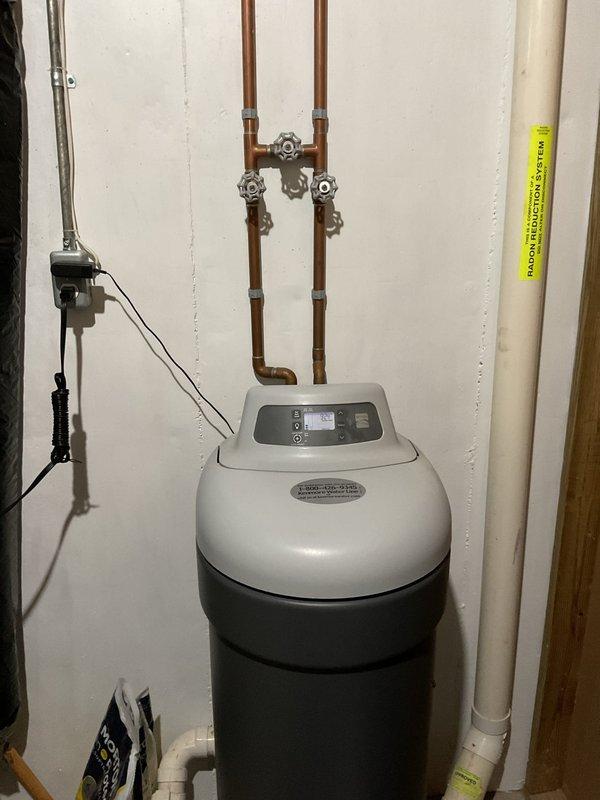 Responded to service call for a Kenmore pellet-type water softener reported as potentially malfunctioning for several months in a side-by-side condo. Upon inspection, the unit appeared properly installed with all plumbing connections intact and no visible signs of damage or leakage. Visual assessment included examination of the digital control panel, copper pipe connections, valve functionality, and drainage system.