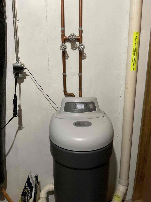 Responded to service call for a Kenmore pellet-type water softener reported as potentially malfunctioning for several months in a side-by-side condo. Upon inspection, the unit appeared properly installed with all plumbing connections intact and no visible signs of damage or leakage. Visual assessment included examination of the digital control panel, copper pipe connections, valve functionality, and drainage system.