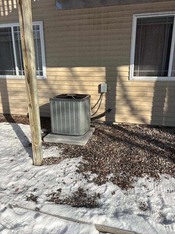 Completed installation of new AC system with same-day service. Installed outdoor condenser unit on concrete pad with proper electrical connections and refrigerant lines. Interior work included connecting to existing ductwork and ensuring proper wall penetration for line set, with all insulation properly restored.